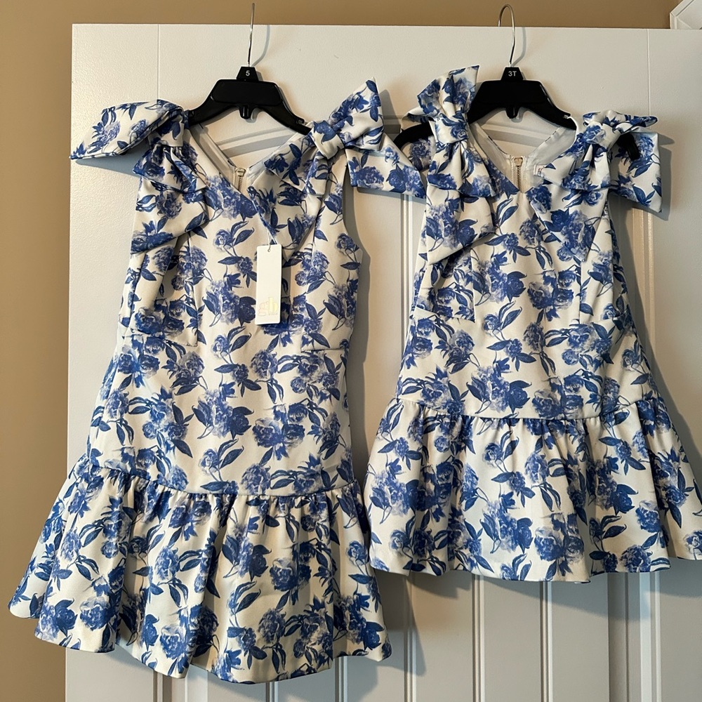 Matching dresses for sisters selling both dresses for $50 total ($25 each)